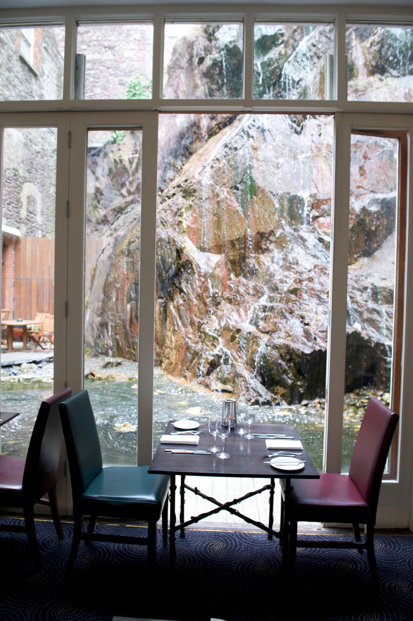 table-for-2-in-front-of-waterfall-at-Greenes-Restaurant.jpg